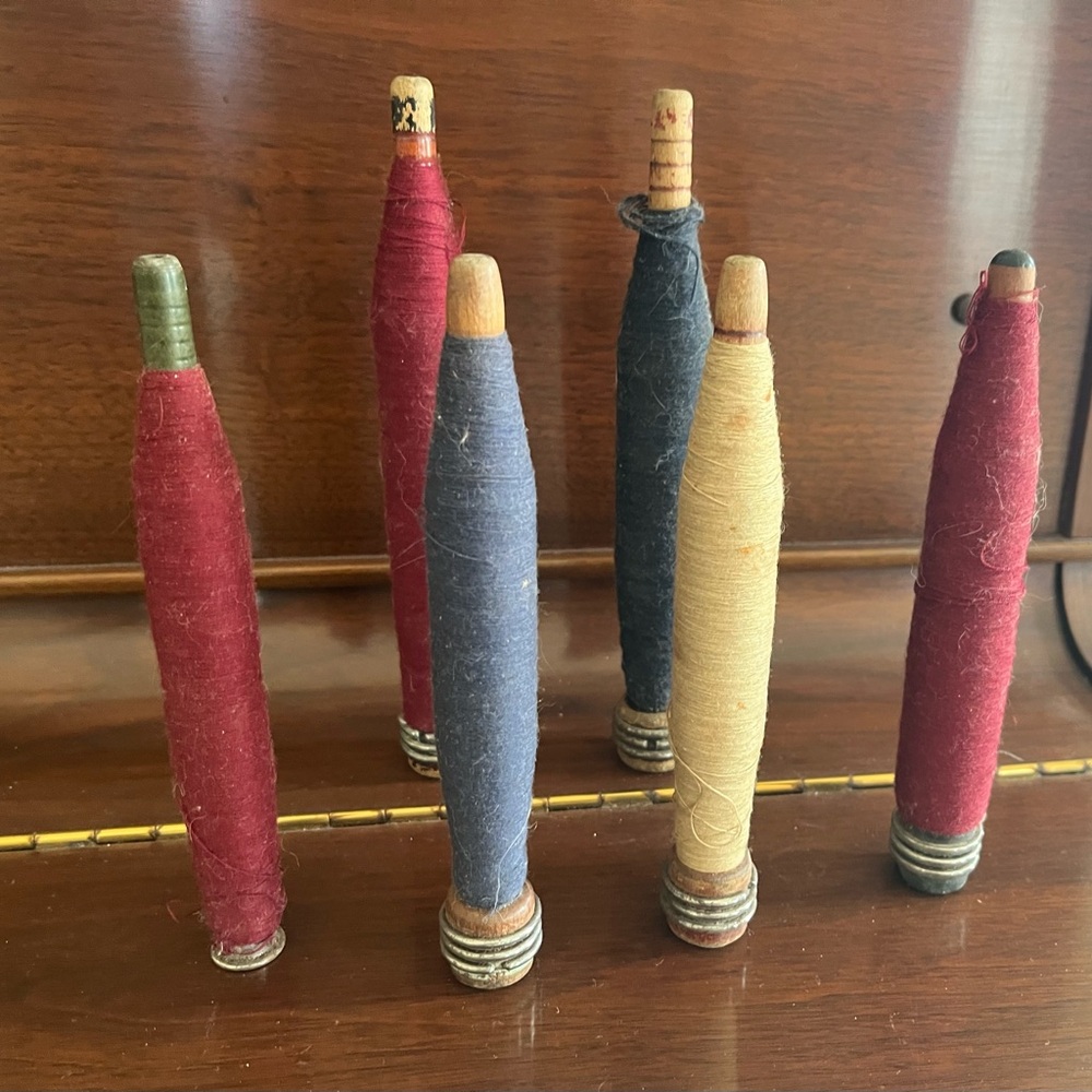 Vintage Wooden Spools with Colorful Threads